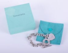 A silver Tiffany & Co 'Please Return to Tiffany & Co, New York' heart toggle bracelet, the heart