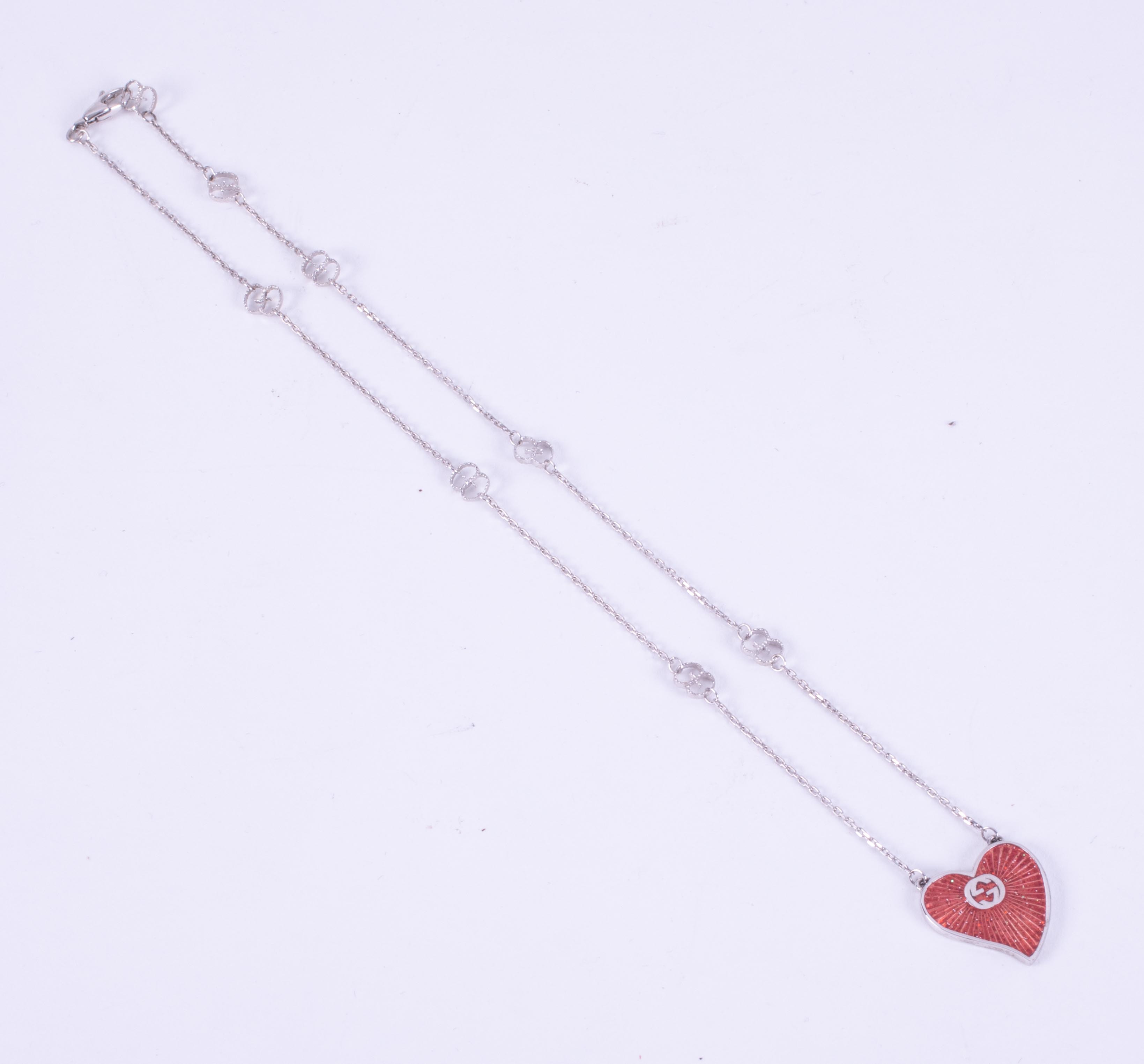 A silver & enamelled Gucci heart necklace with the Gucci logo in the chain as well as on the - Image 2 of 3