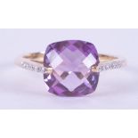 A 9ct yellow gold ring set with a fancy mixed cushion cut amethyst, approx. 5.30 carats, with