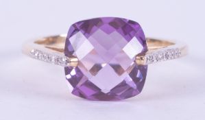 A 9ct yellow gold ring set with a fancy mixed cushion cut amethyst, approx. 5.30 carats, with