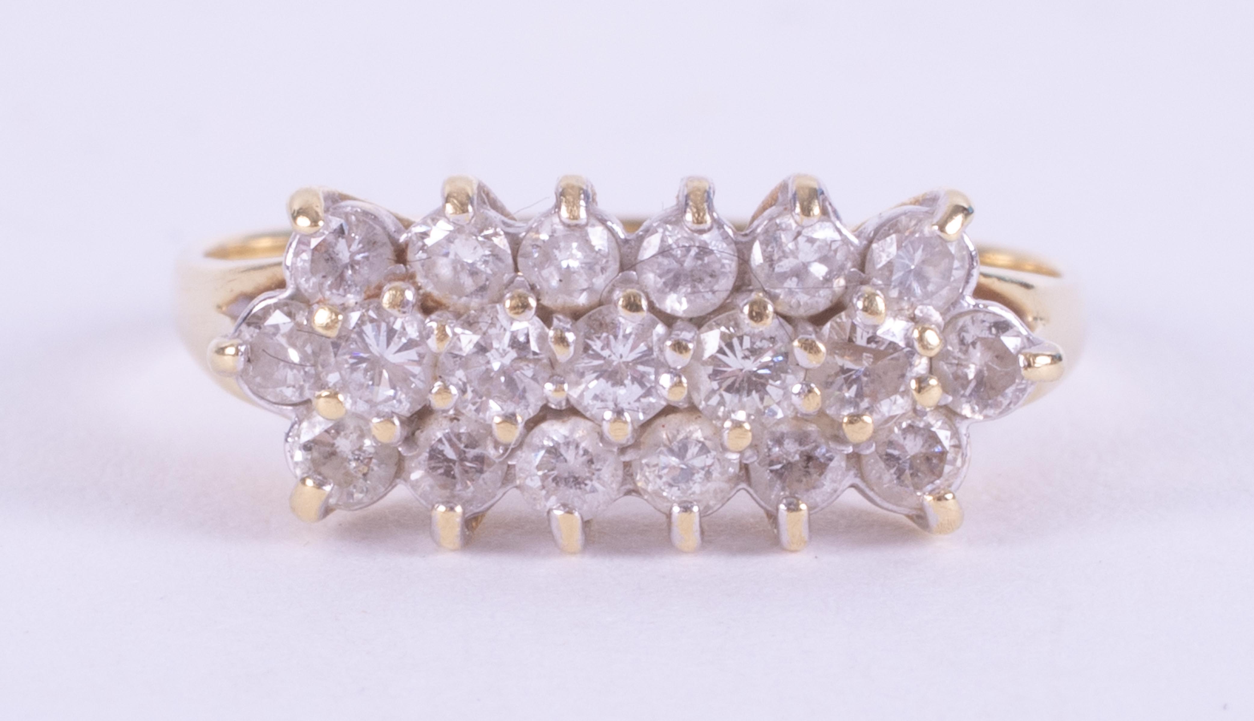 An 18ct yellow gold three row ring set with approx. 0.67 carats of round brilliant cut diamonds, 2.