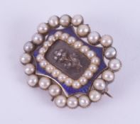 A Georgian brooch with a central flower design set with tiny old rough cut diamonds and surrounded