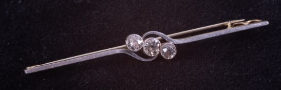 A yellow & white gold (not hallmarked or tested) bar brooch with a central twist design set with