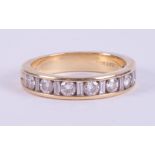 An 18ct yellow gold half eternity ring set with alternating baguette cut & round cut diamonds, the