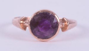 A 9ct rose gold ring with a rubover set round cut amethyst, approx. 1.30 carats, 1.61gm, size N to N