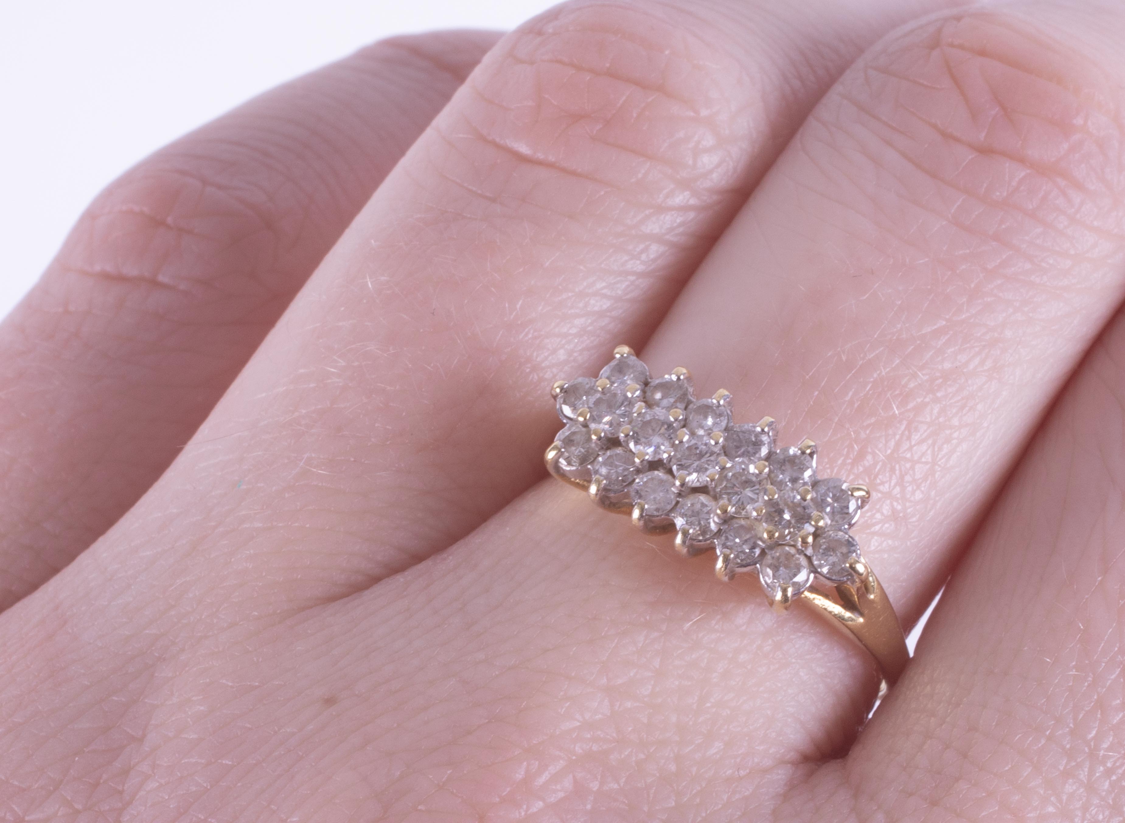 An 18ct yellow gold three row ring set with approx. 0.67 carats of round brilliant cut diamonds, 2. - Image 2 of 2