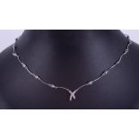 A 14ct white gold articulated necklace with a cross design at the centre set with small round