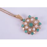 A 9ct yellow gold flower design pendant set with turquoise and pearls, 2.2cm diameter (not including