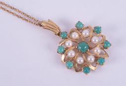 A 9ct yellow gold flower design pendant set with turquoise and pearls, 2.2cm diameter (not including