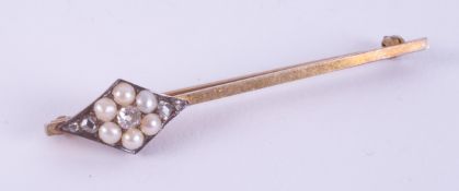 A 9ct yellow gold bar brooch with a diamond shaped design off-set to one end set with pearls and old