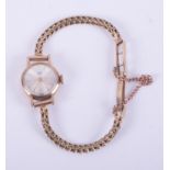 Tudor, a 9ct yellow gold ladies Tudor Royal wristwatch with safety chain, 10.73gm.