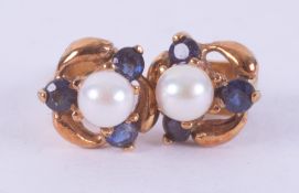 A pair of yellow gold (not hallmarked or tested) earrings set with a cultured pearl and three