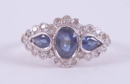 An 18ct yellow & white gold ring set with a central oval cut sapphire, approx. 0.36 carats and a