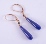 A pair of 9ct yellow gold drop earrings set with a teardrop shaped blue lapis lazuli with gold