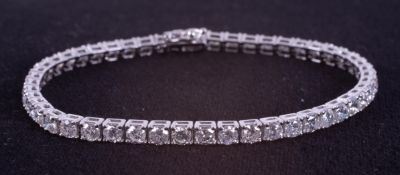 An 18ct white gold line bracelet set with approx. 7.20 carats of round brilliant cut diamonds,