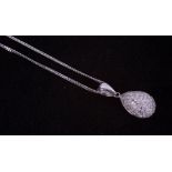 An 18ct white gold illusion setting pendant set with small round brilliant cut diamonds on an 18ct