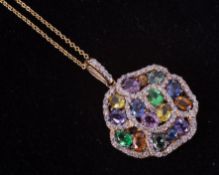 A 14ct yellow gold flower design pendant set with a mixture of different cut & colour sapphires,