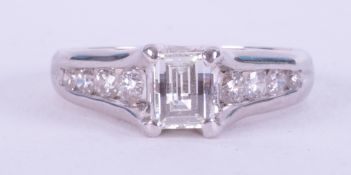 An 18ct white gold ring set centrally with 0.80 carats of an unusual fancy rectangular cut diamond