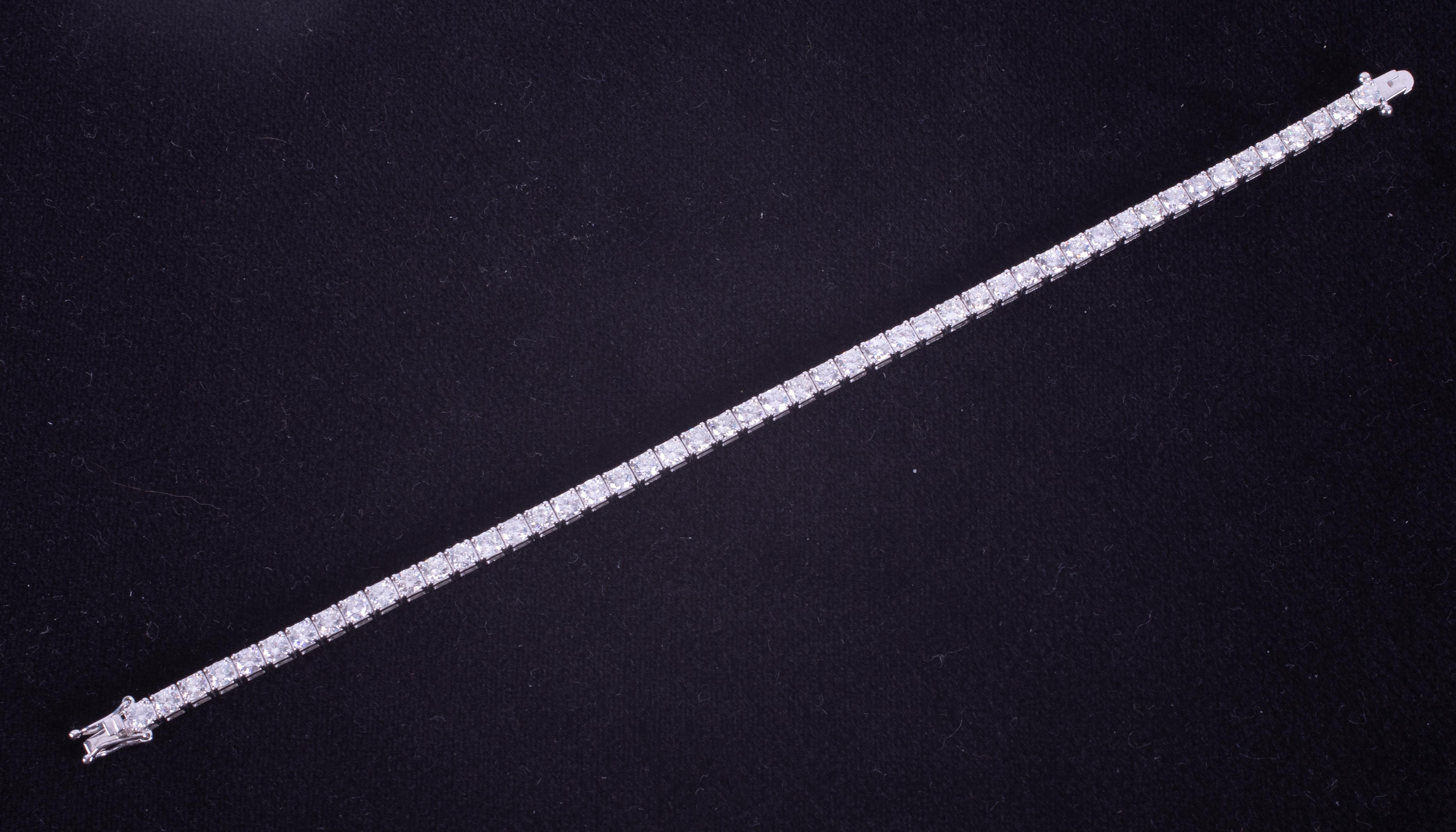 An 18ct white gold line bracelet set with approx. 7.20 carats of round brilliant cut diamonds, - Image 2 of 3