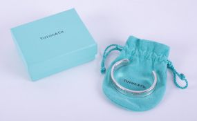 A silver Tiffany & Co concave design cuff bangle, stamped inside 1997 Tiffany & Co 925 and on the