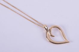 An 18ct yellow gold Tiffany & Co pendant and chain, the pendant being in the shape of a heart,