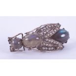A silver? Victorian brooch in the form of a fly set with cabochon cut labradorite and tiny seed