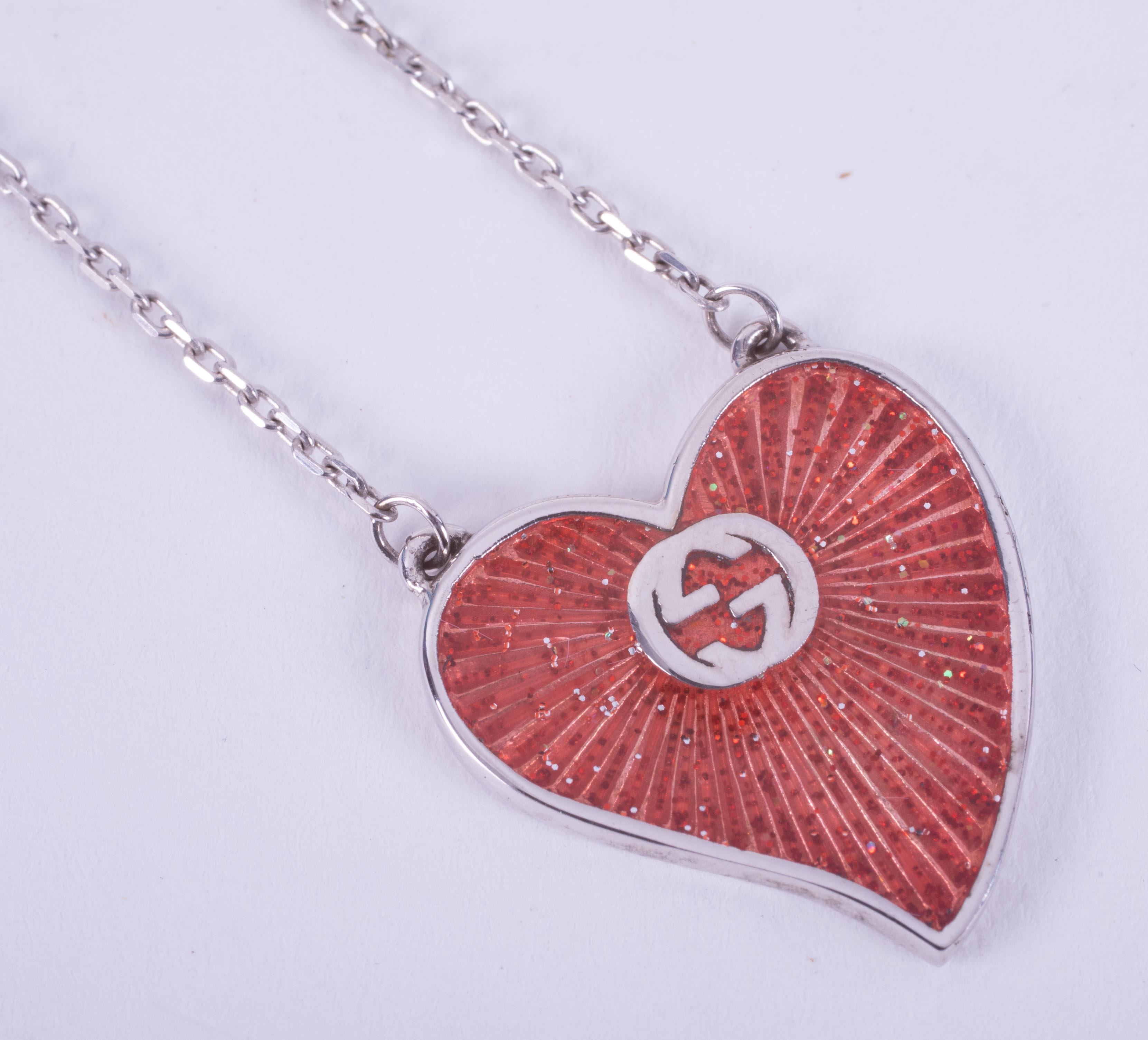 A silver & enamelled Gucci heart necklace with the Gucci logo in the chain as well as on the - Image 3 of 3