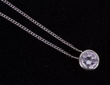 A 9ct white gold rubover pendant set with approx. 1.28 carats of round brilliant cut diamond,