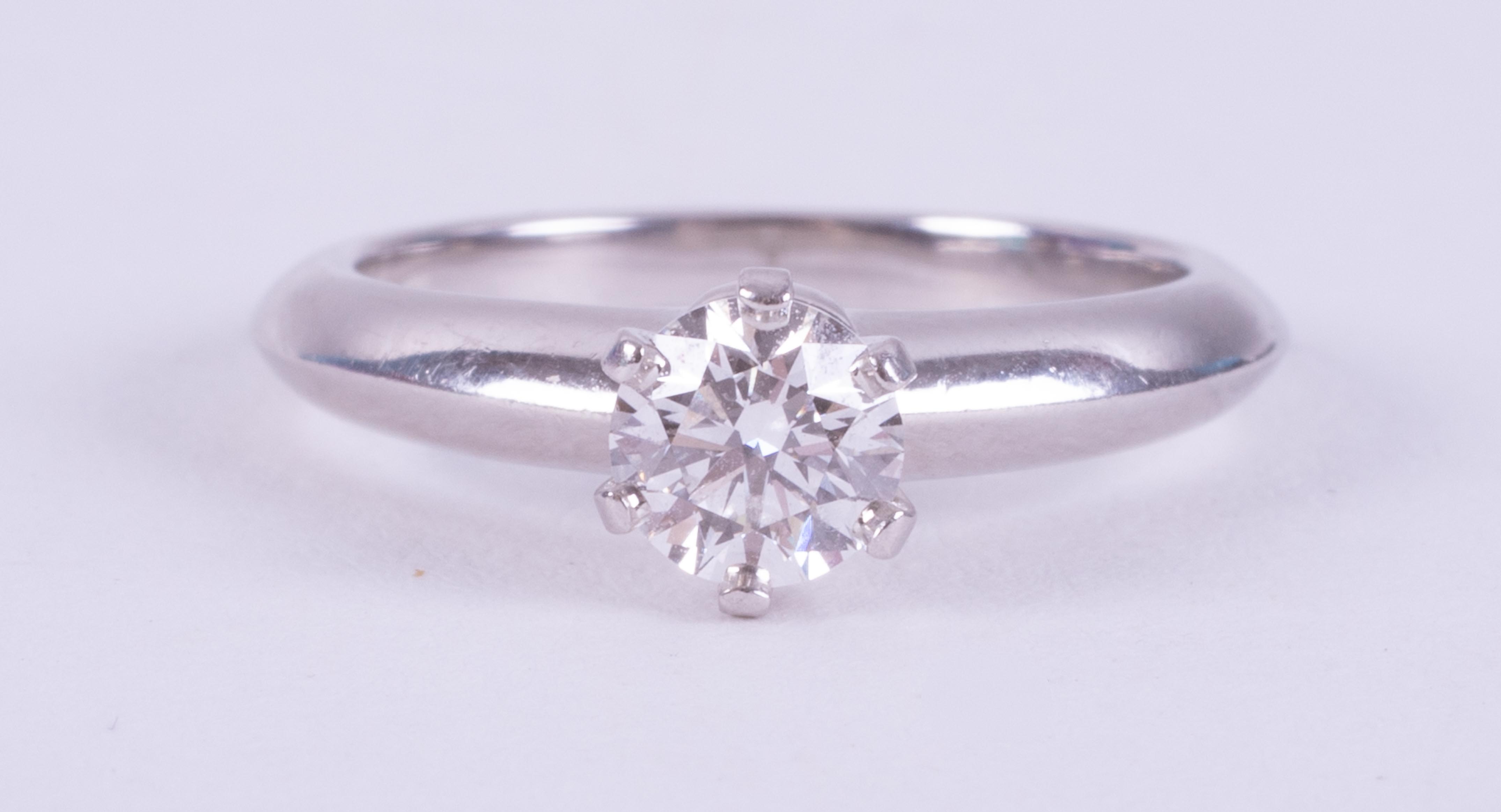 A platinum Tiffany & Co ring set with a round brilliant cut diamond, 0.51 carats, colour E and VS1