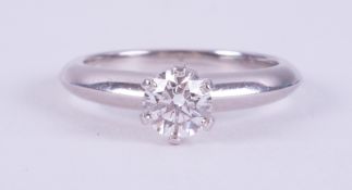 A platinum Tiffany & Co ring set with a round brilliant cut diamond, 0.51 carats, colour E and VS1