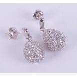 A pair of 18ct white gold drop earring with an illusion setting set with small round brilliant cut