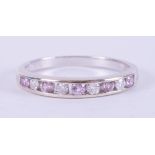 A 9ct white gold half eternity style ring set with four round brilliant cut diamonds, total weight