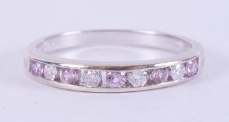 A 9ct white gold half eternity style ring set with four round brilliant cut diamonds, total weight