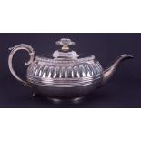 A Georgian silver squat teapot with acanthus scroll handle, London hallmark, letter b 1817-18,