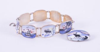 A sterling silver Norwegian mid century bracelet and matching brooch with guiloche enamel scenic