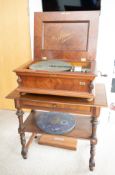 A Victorian Orphenion walnut table polyphon music box. Considered the very best table music boxes to