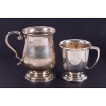 A silver baluster shaped christening mug with scroll handle, height 7cm, together with a small