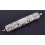 An Eastern white metal (possibly silver) scroll holder with engraved pierced decoration, length