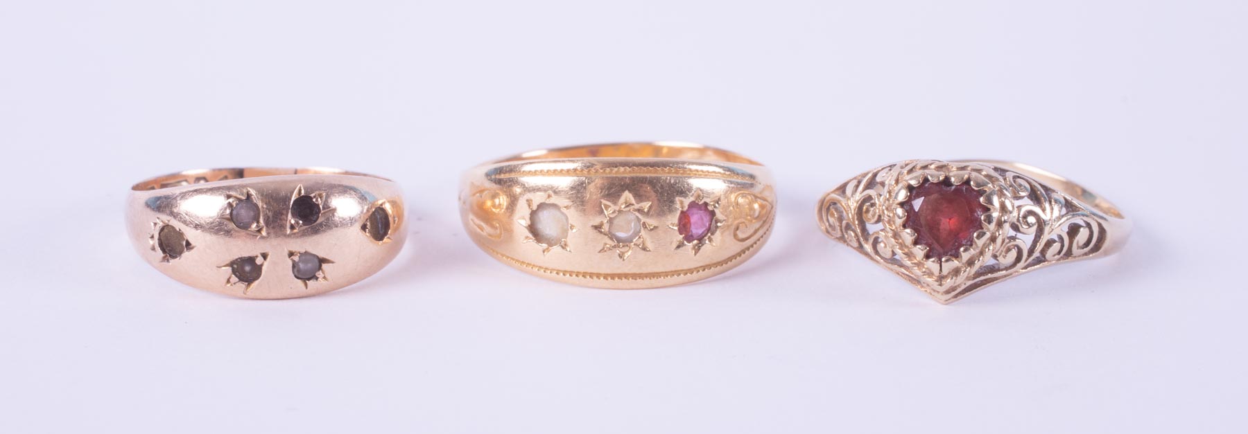 Three rings to include an 18ct yellow gold ring (hallmark has worn away) with red stone - Image 2 of 2