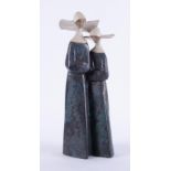 Lladro, a figurine of a pair of stoneware Nuns, height 34cm.