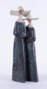 Lladro, a figurine of a pair of stoneware Nuns, height 34cm.