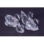 Swarovski Crystal Glass, collection of four Swans (one possibly repaired), boxed.