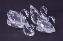 Swarovski Crystal Glass, collection of four Swans (one possibly repaired), boxed.