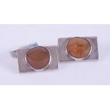 A pair of rectangular silver & agate cufflinks.