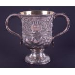 A Georgian silver twin handled cup with embossed decorated with flowers, London hallmark, letter H