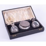 A three piece scent bottle set comprising atomiser, scent bottle and powder box, each in glass and