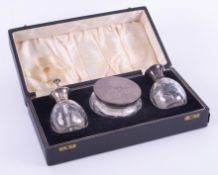 A three piece scent bottle set comprising atomiser, scent bottle and powder box, each in glass and