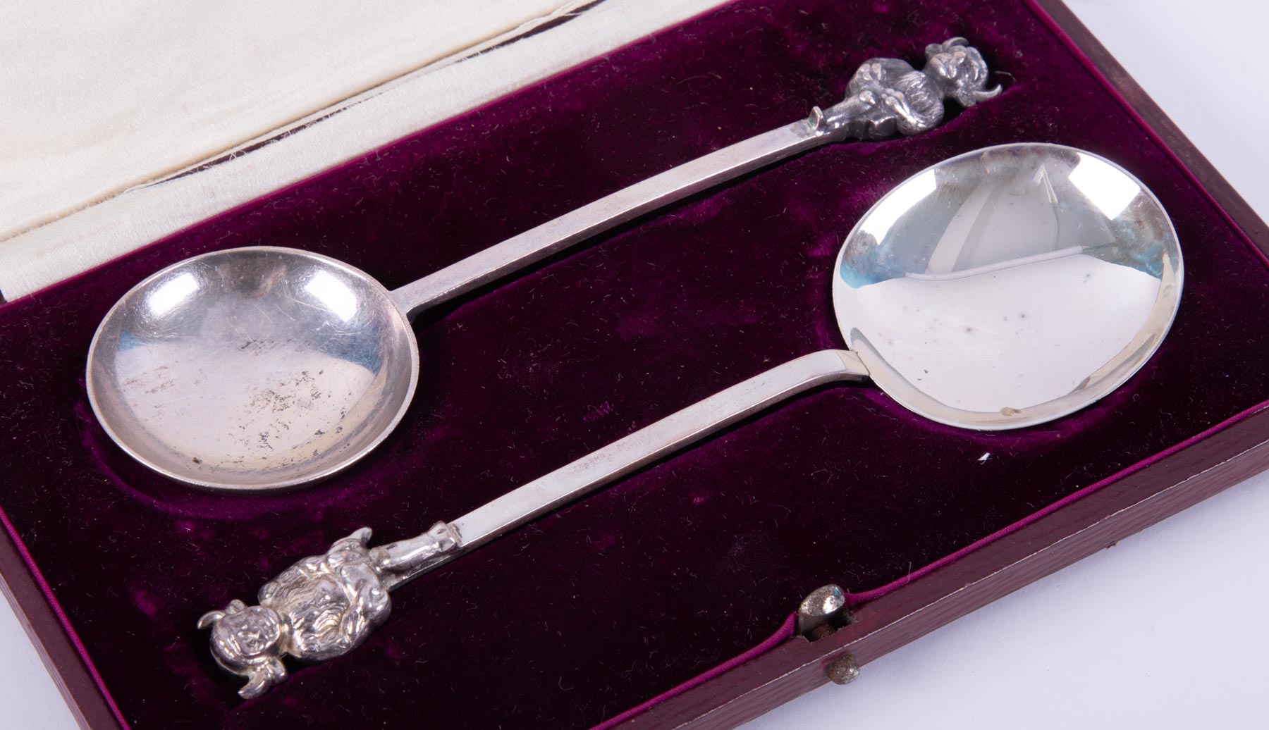 James Usher & Son, a pair of silver spoons with devil finials, approx weight 55.1g, cased. - Image 2 of 2