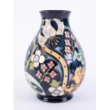 Moorcroft, a Golden Lily vase, height 19cm, boxed.