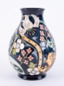 Moorcroft, a Golden Lily vase, height 19cm, boxed.